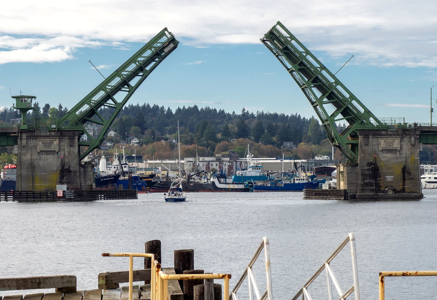 The Ballard Bridge open over Salmon Bay with the Seattle fishing fleet moored beyond