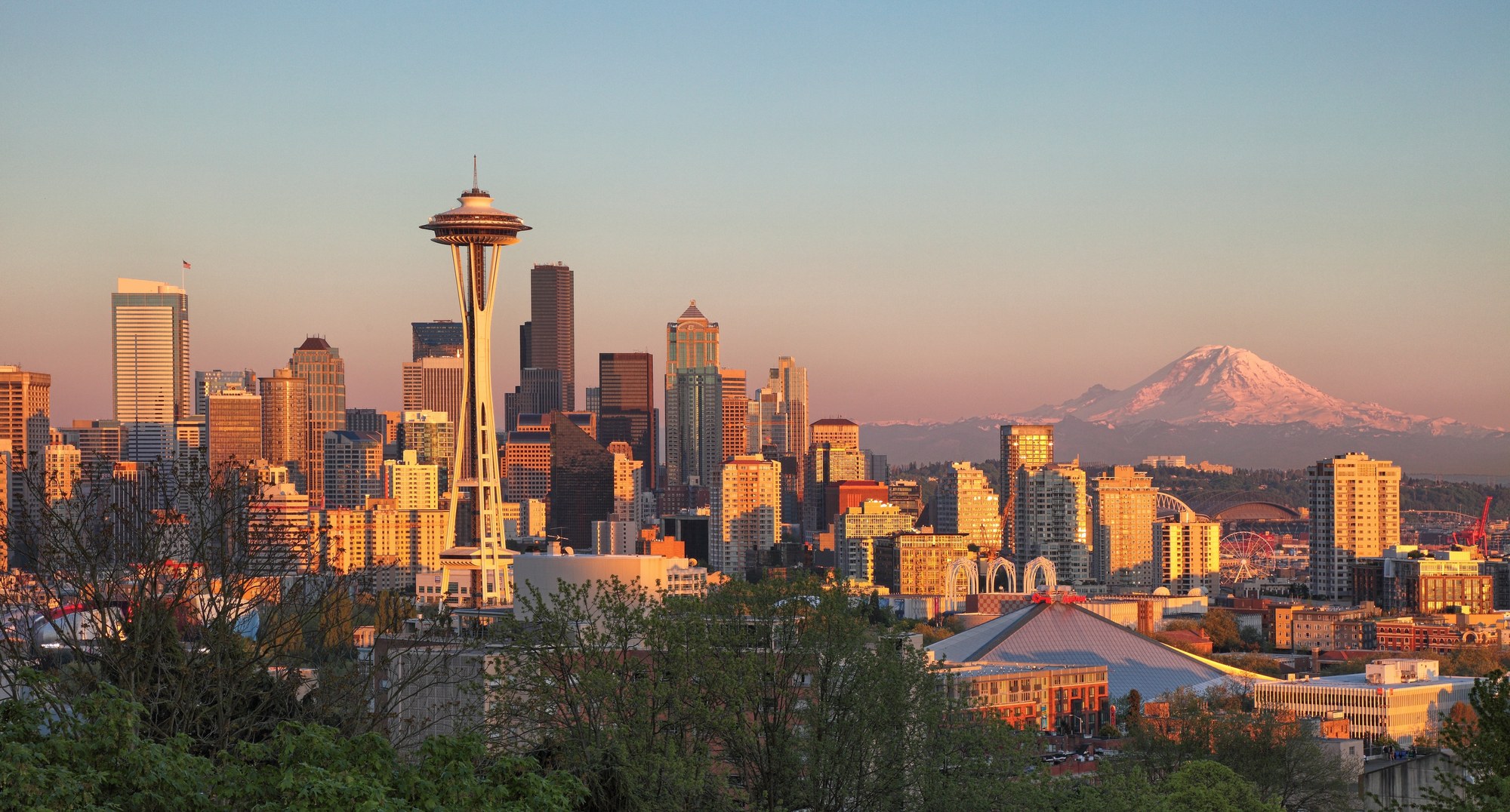 The Seattle skyline at sunset with Mount Rainier beyond